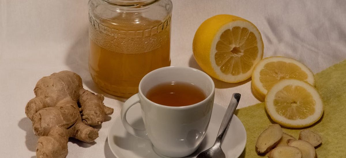 A cozy setup featuring ginger lemon tea with honey, promoting wellness and comfort.