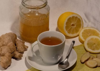 A cozy setup featuring ginger lemon tea with honey, promoting wellness and comfort.